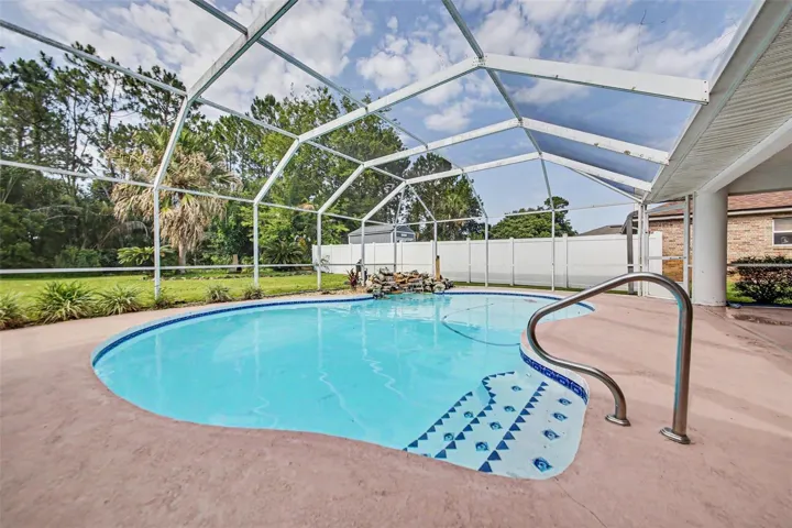 Enjoy the large screened lanai and beautiful pool, perfect for relaxing and entertaining