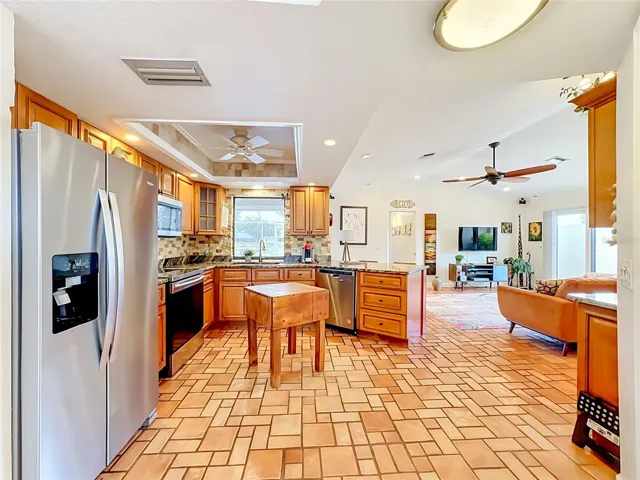 Updated kitchen with granite counter tops and SS appliances