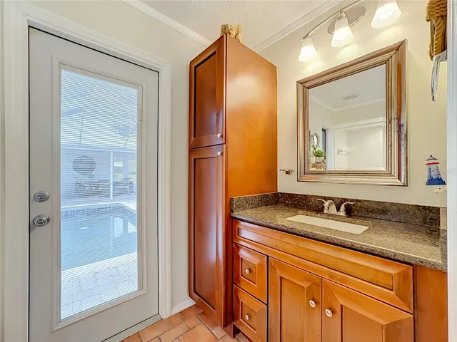 Second bathroom that has direct access to the pool area