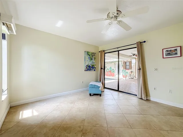 Primary bedroom with direct access to the pool lanai