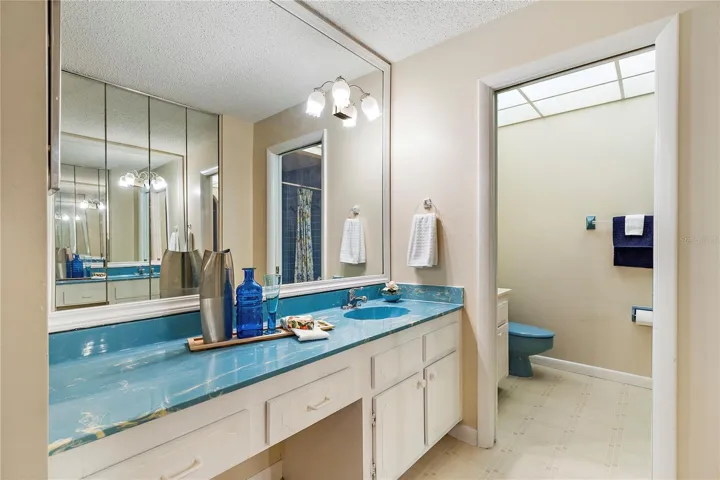 Primary bathroom w/ makeup chair room