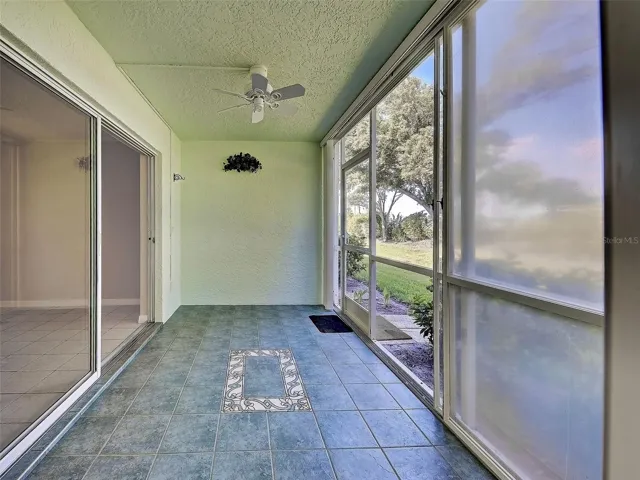 Tiled, screened lanai with vinyl sliders