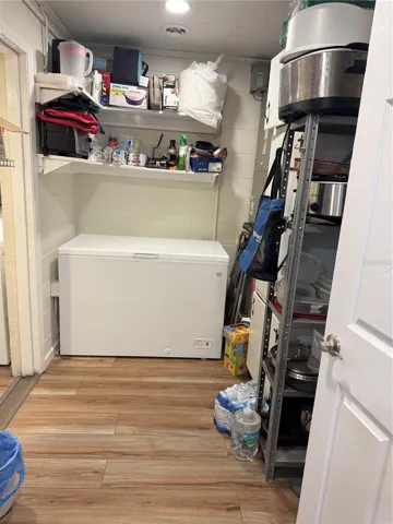 Large laundry room with storage area