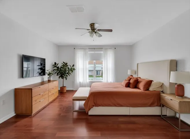 Virtually Staged Primary Bedroom- Hardwood Floors throughout!