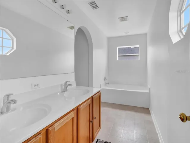 Double sinks, Garden Soaking Tub and private water closet and shower room.