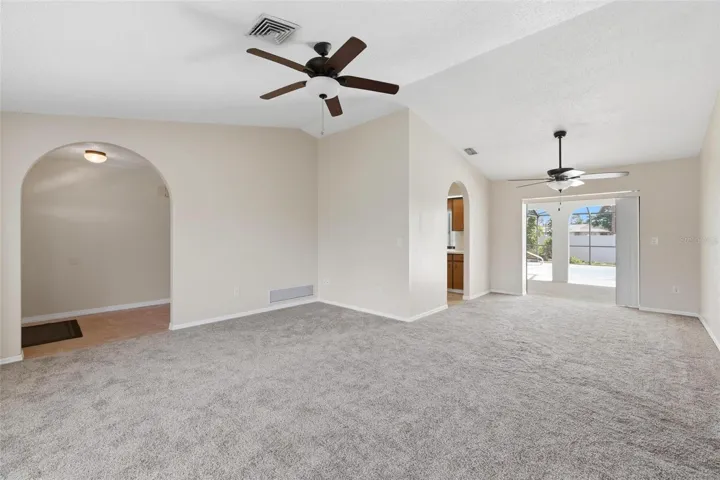 Living room to Dining room.... vaulted ceiling