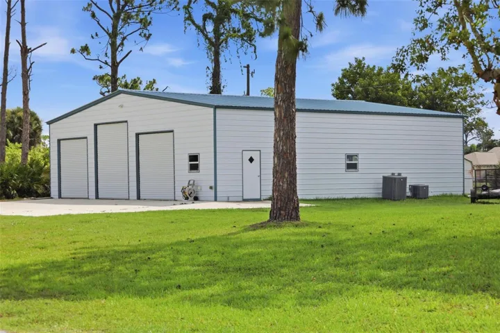 Huge Detached 2496 sf Air Conditioned Garage/Workshop/Mancave with it's own 5 ton A/C unit....
