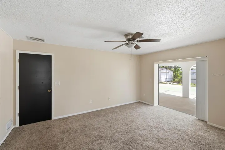 Primary Bedroom with pocket sliding glass door out to your lanai/pool.