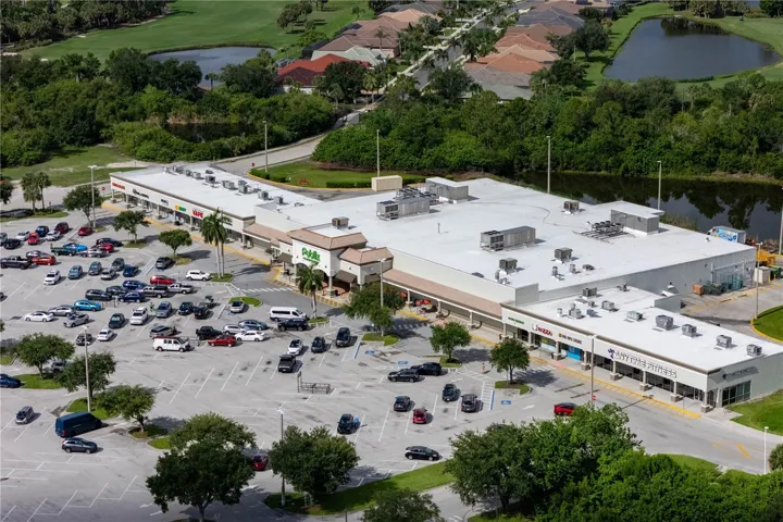 Grocery-anchored shopping center offering grocery, fitness, dining, and retail services.