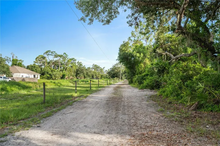 Private road access leads to this beautiful 7-acre wooded retreat.
