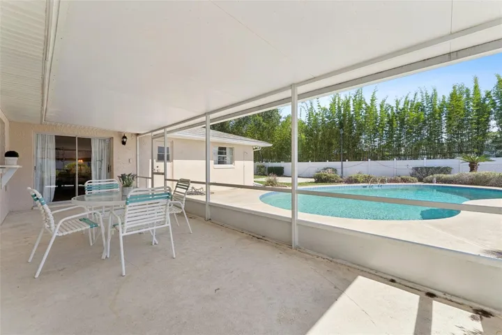 Designed with entertaining in mind, this home invites you to relax and gather under the expansive covered lanai while taking in views of the oversized backyard and sparkling pool.