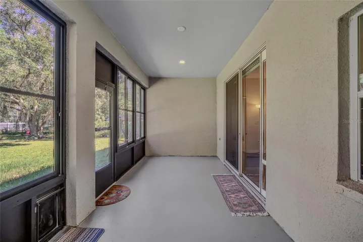Lanai with enclosed vinyl windows that can be easily removed.