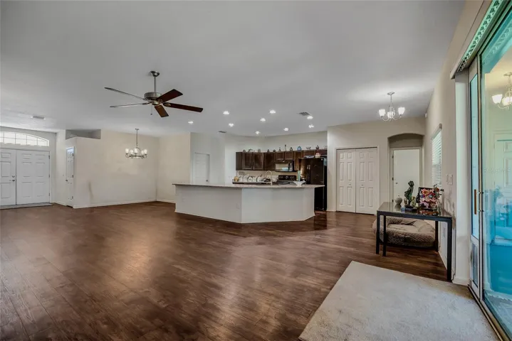 View of the great room and kitchen from the back sliders.