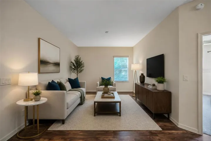To the right as you walk into the home is an area you can use a formal dining area or entertainment area which is virtually staged.
