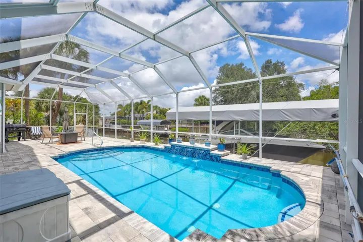 Completely renovated 2025 pool featuring new concrete, elegant pavers, and [a] refinished pool surface.