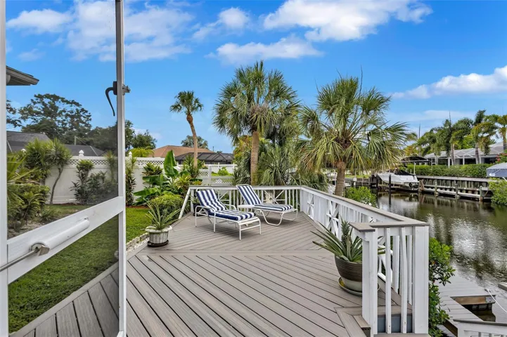 Additional outdoor sitting area perfectly positioned to enjoy the incredible waterfront setting.