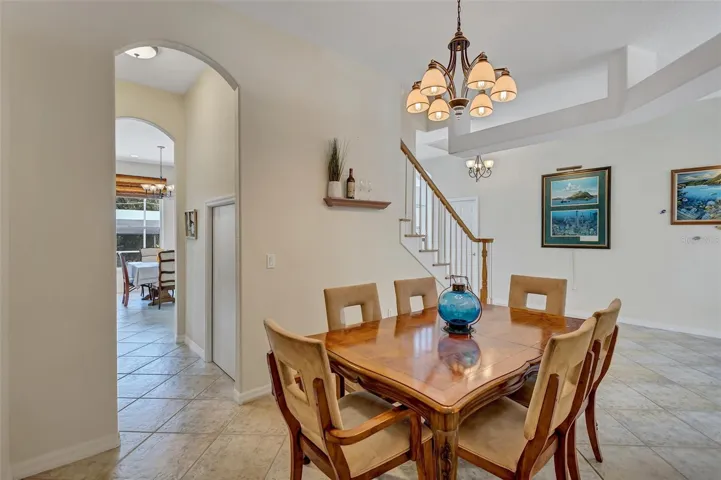 Formal dining with steps to the upper bedrooms.