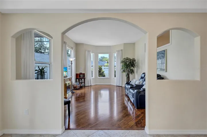 Front den sitting area with engineered hardwood flooring.