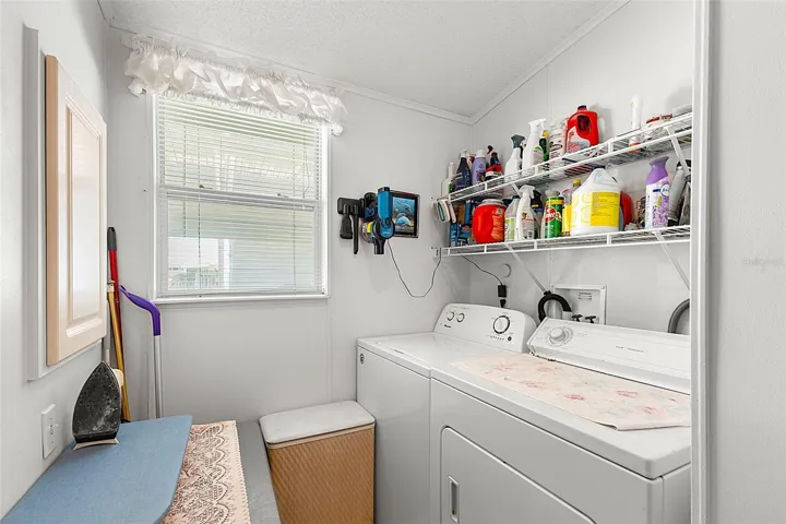 Utility room with washer and dryer