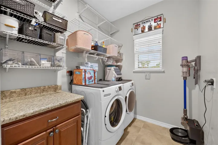 Laundry Room | Functional laundry room with storage and workspace convenience.