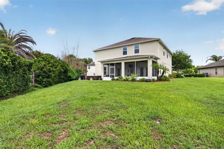 Rear Exterior | Large backyard offering plenty of room for recreation, pets, and outdoor activities.