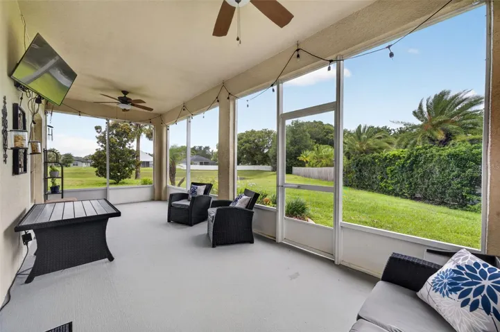 Screened Lanai | Covered screened lanai creating the perfect setting for year-round outdoor enjoyment.