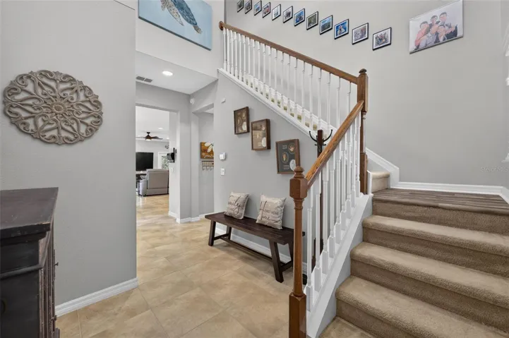 Foyer & Staircase | Bright foyer featuring elegant staircase access to the second level.