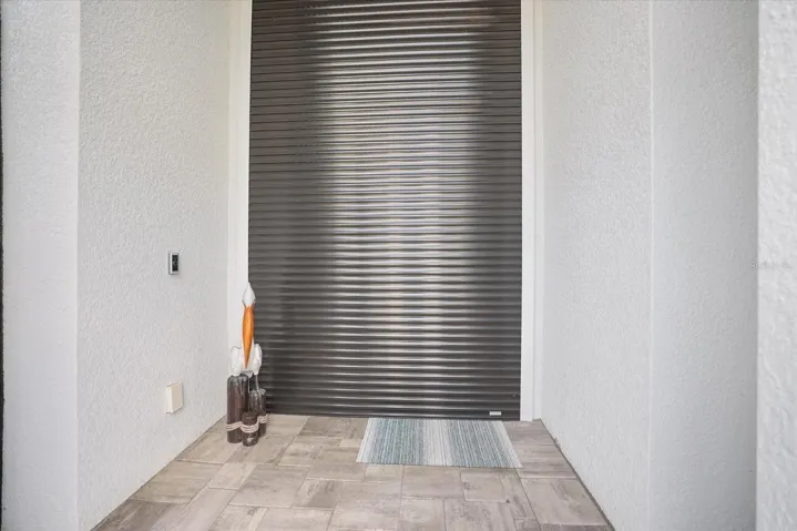 Electronic Hurricane Shutter for Front Door