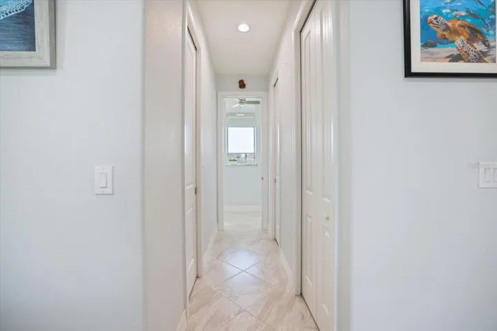 Two Separate Walk-In Closets In Hallway To Primary Bath