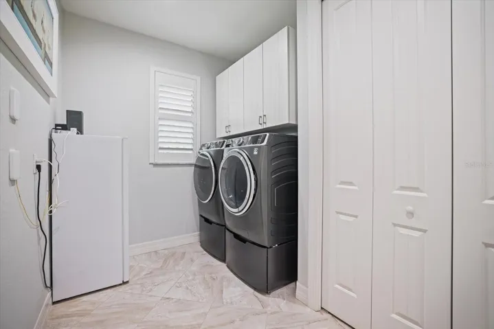 Laundry Room Has Generous Storage/Pantry