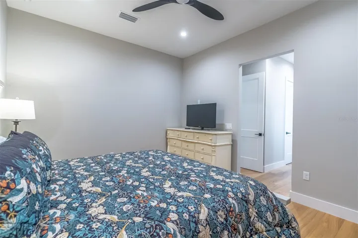 Primary suite, looking toward closets and bath, entrace to the suite is to the left.