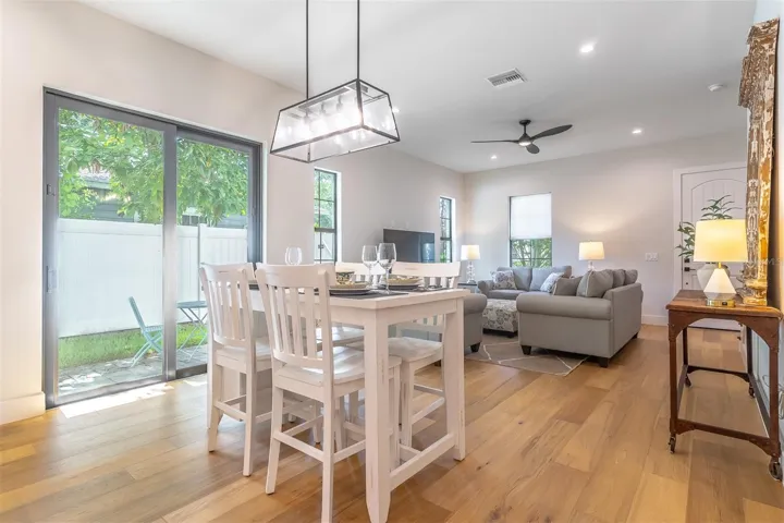 From the kitchen, looking into living space and to the private courtyard.