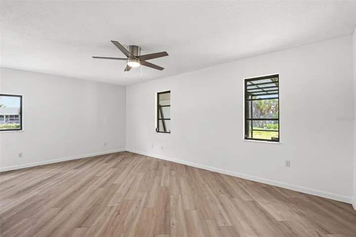 Primary Bedroom with 3 windows for great natural lighting