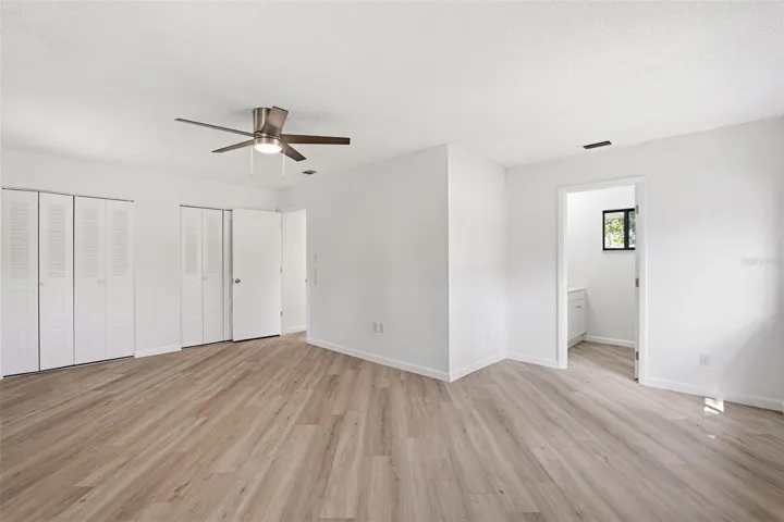 Primary Bedroom with two Closets and TV Wall