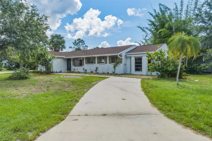 Beautiful Curb Appeal with Expansive Yard and Ample Parking