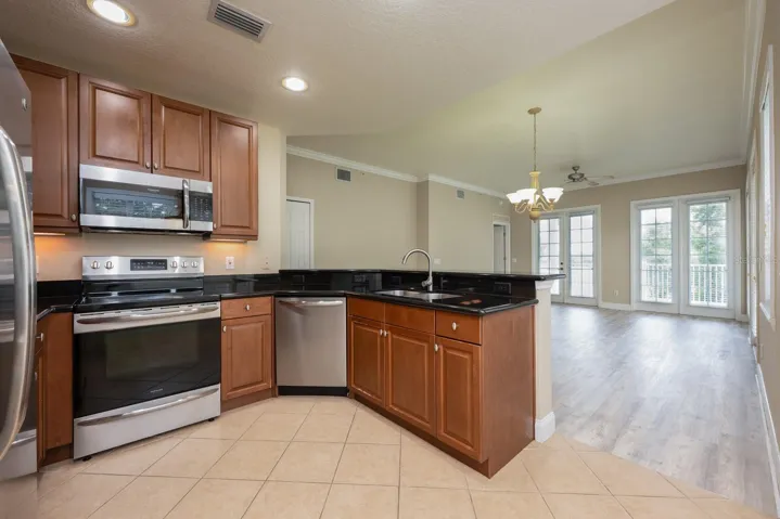 Kitchen is open to the living and dining.