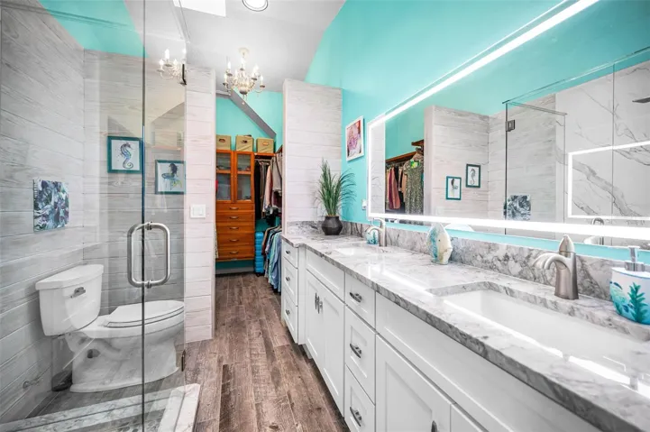 Fully reimagined Primary bath showcasing sleek contemporary design and upscale materials
