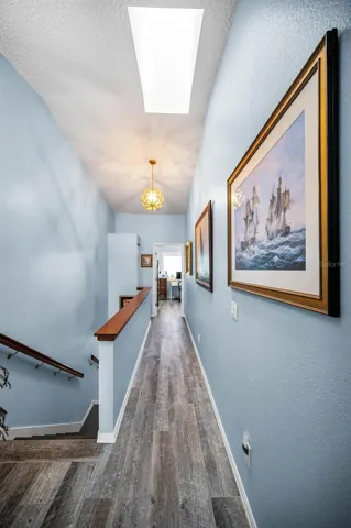 Landing and hallway on the upper level connecting the two bedrooms upstairs.
