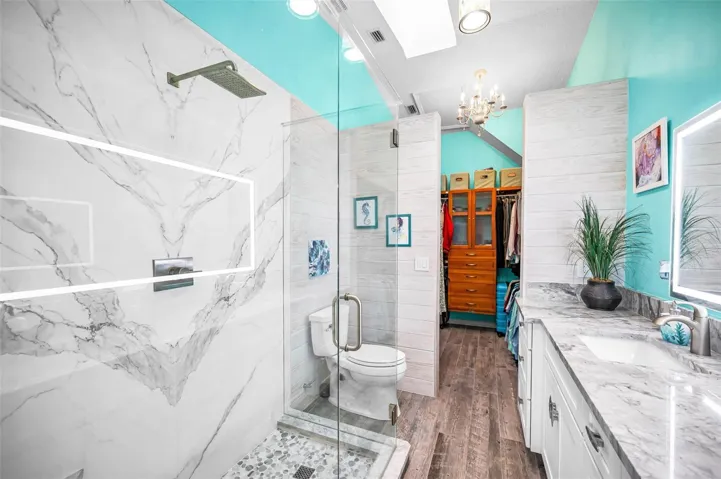 A top-to-bottom renovated primary suite bath with refined, modern detailing