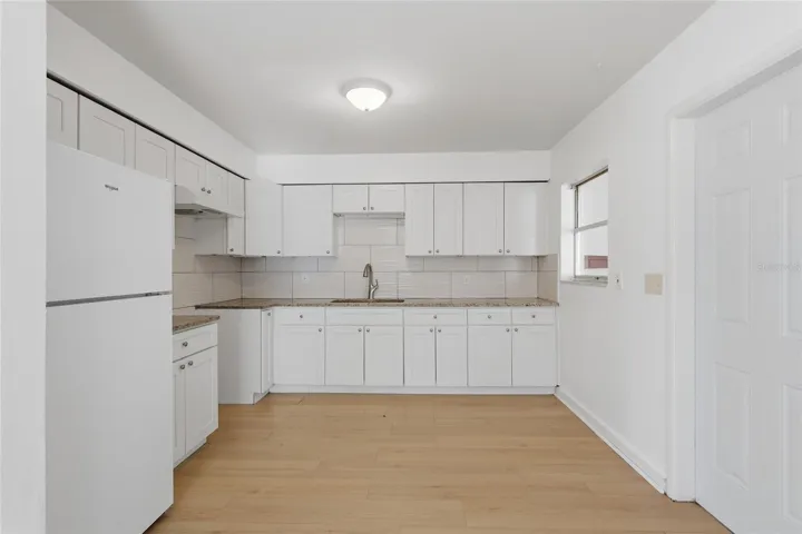 Newer soft close kitchen cabinets and drawers and granite counters.