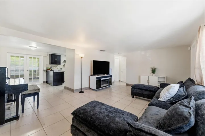 Living room open to the kitchen and dining area
