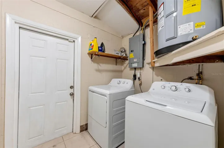 Inside Laundry room with exit to side yard and garage