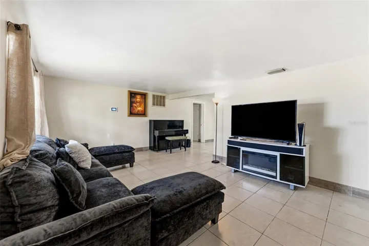 Walk in to your open living room with high ceilings througout