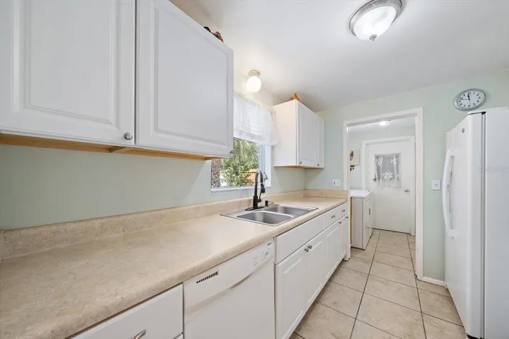 Laundry room adjacent to the kitchen
