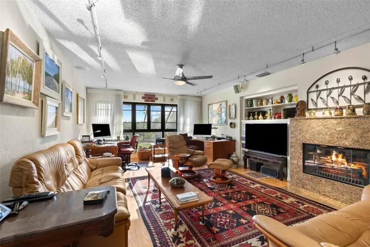 Downstairs great room overlooking property, pool and water