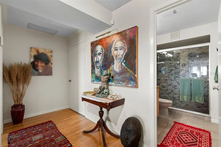 Downstairs full path, laundry room in corner and to the left large bedroom