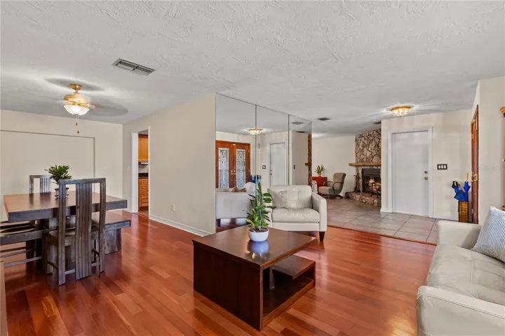 Spacious living and dining area featuring an open-concept design, abundant natural light, and seamless flow between spaces—perfect for both everyday living and entertaining family and friends