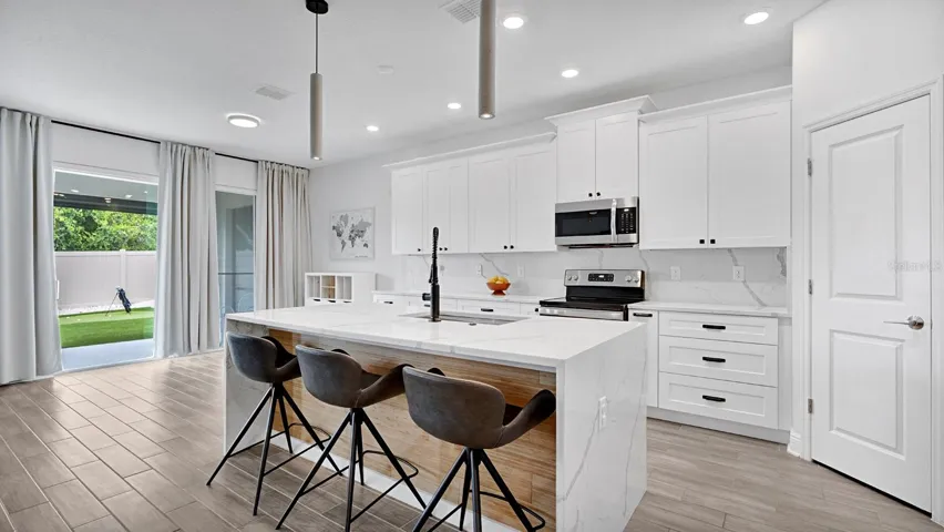 Island with waterfall edge quartz countertops