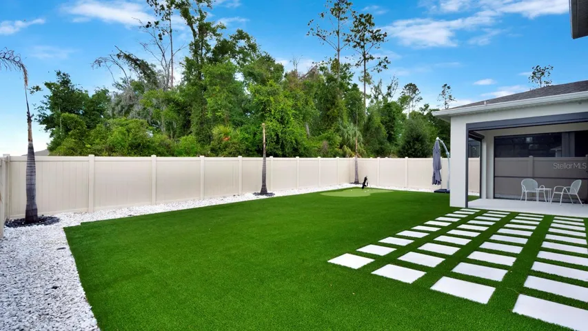 Backyard with turf and putting green
