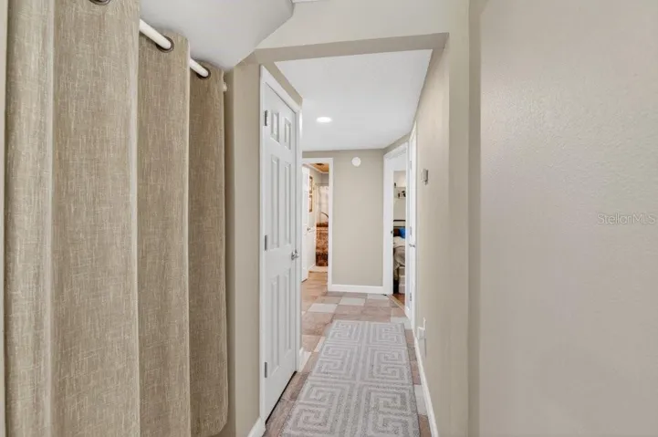 Hall to 2 bedrooms.